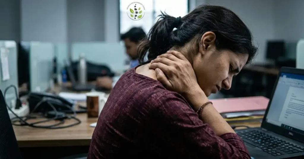 Woman with neck pain at office desk needing physiotherapy in Chhatrapati Sambhajinagar