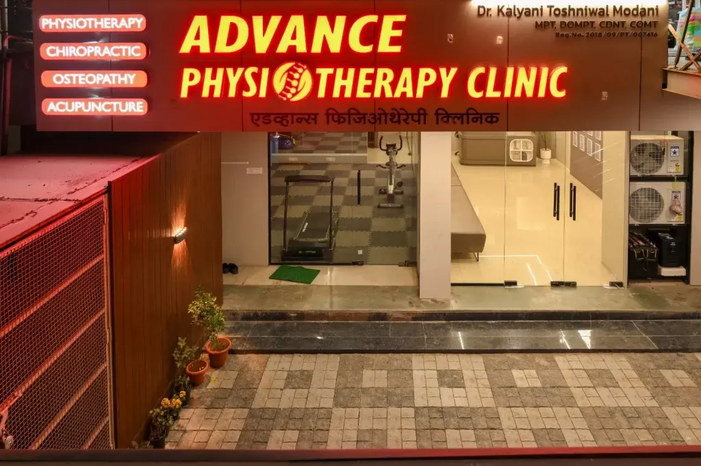 Advance Physiotherapy Clinic illuminated signboard at night