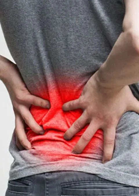 Person with lower back pain caused by sciatica